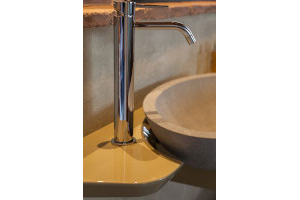 Laquered wood shelf, carved <i>pietra serena</i> sink and Gessi faucet