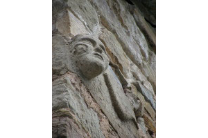 … On the corner of the 14th century watch tower a mysterious face with a snake…: certainly a sciamanic meaning behind that